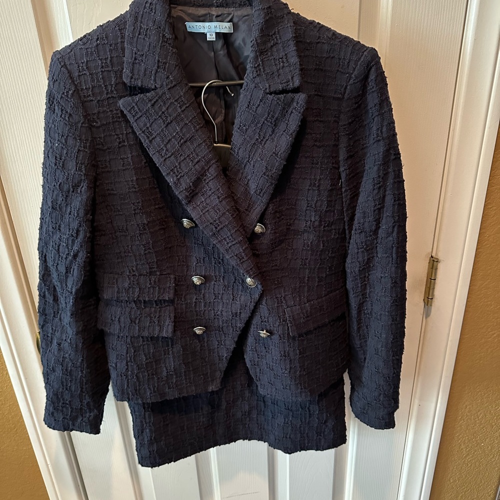 Navy blue boucle two piece suit with pencil skirt above the knee